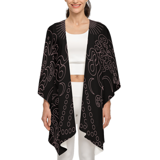 Women's recycled kimono in the style 'Daring' which features a black background with an ornate beige pattern