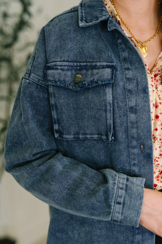 Close-up of front panel with pocket of blue jean mineral wash shacket jacket 
