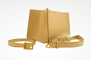 Tan beige interchangeable accessories for Lavada vegan leather handbag, includes outer cover, strap, and belt. Shown against white background.