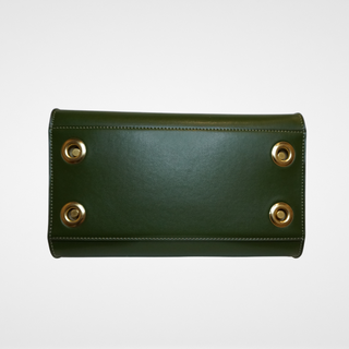 Interchangeable vegan leather bag in green, view of outer cover bottom with antique brass grommets