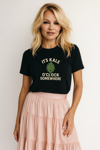 Woman wearing a funny vegan black t-shirt that says It's Kale O'Clock Somewhere