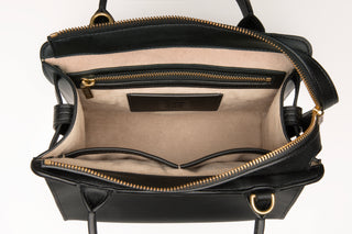 Interior of Lavāda vegan leather handbag in black with soft exquisite tan microsuede lining