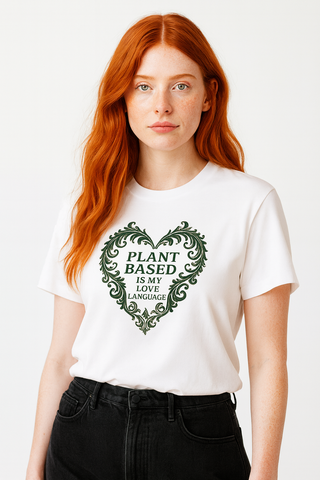 Red haired female model wearing white cotton funny vegan tshirt that says Plant Based is My Love Language