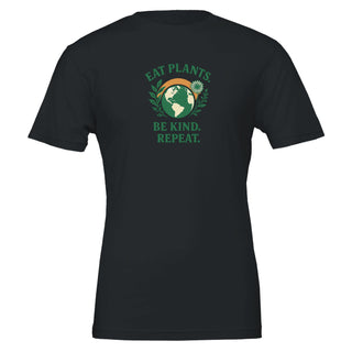 Black t-shirt with green and white graphic that reads "Eat plants, be kind, repeat." 100% cotton. Eco friendly