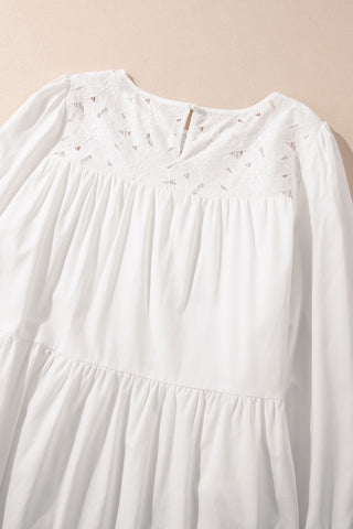 Close up, flat view of white cotton dress, tiered
