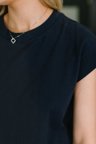close up view of navy blue cotton midi dress featuring round neckline 