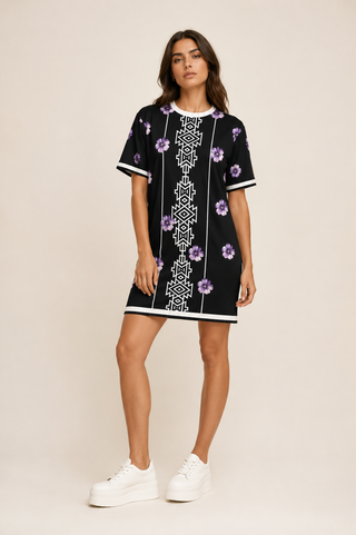 Woman wearing a black white and purple 95% cotton tshirt dress 