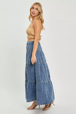 dark wash denim maxi skirt, a line, tiered, 100% cotton shown on model in three quarter view