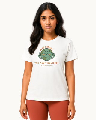 Model wearing a humorous white tshirt that reads 'dear humans, you can't manifest a new planet' 100% premium cotton tshirt