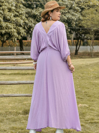 rear view of lavender viscose plus sized v neck midi dress