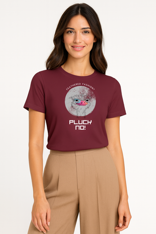Woman wearing a maroon graphic funny vegan t-shirt featuring an ostrich saying, "Feathered fashion? Pluck no!"