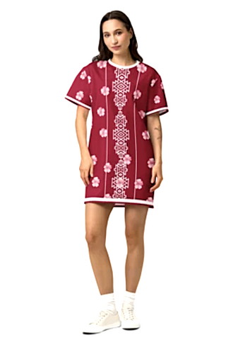 Woman wearing a red dress with bold graphic white patterns and pink flowers on a white background