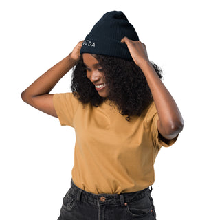female model wearing 100% organic cotton ribbed beanie by Lavada in navy