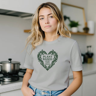 model wearing silver funny vegan tshirt that reads 'Plant based is my love language' 100% airlume cotton