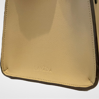 Closeup view of side gusset, Lavada interchangeable vegan leather handbag