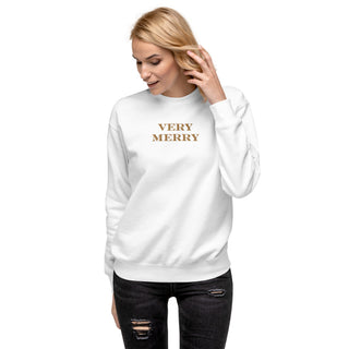 model wearing gold embroidered Very Merry sweatshirt in white