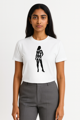 Person wearing a white t-shirt with a black graphic in the curvy shape of a female that spells the word Woman. Plain background